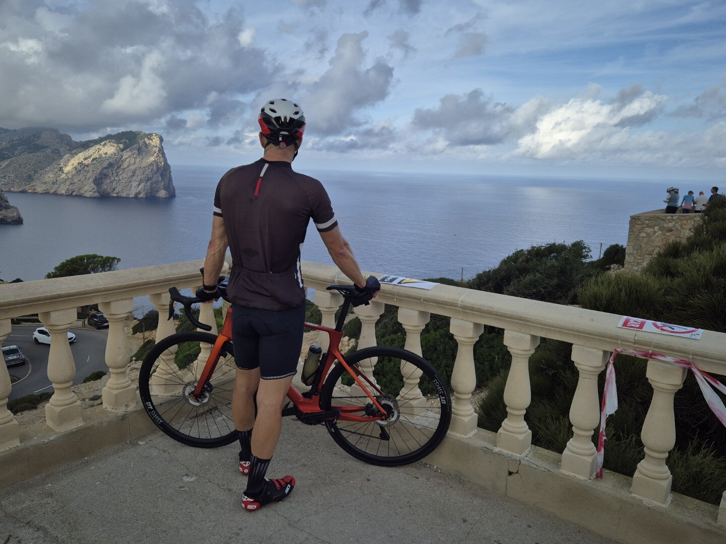 Road cyclist overlooking the Mediterranean coast